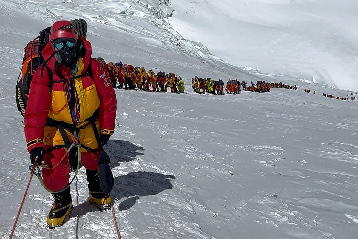 Climbers reaching the summit of Mount Everest during the record season.