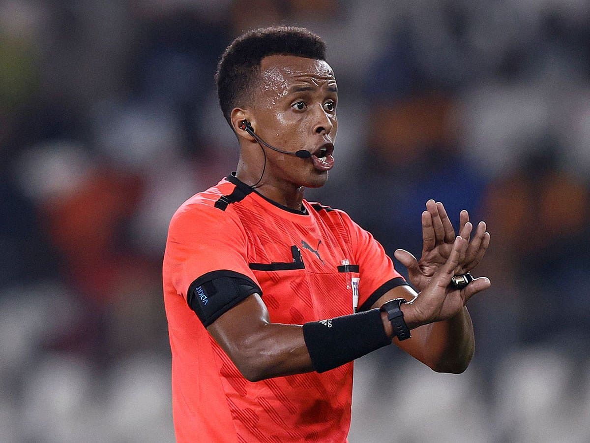 Somali referee Omar Artan removed from World Cup officiating roster due to US entry denial.