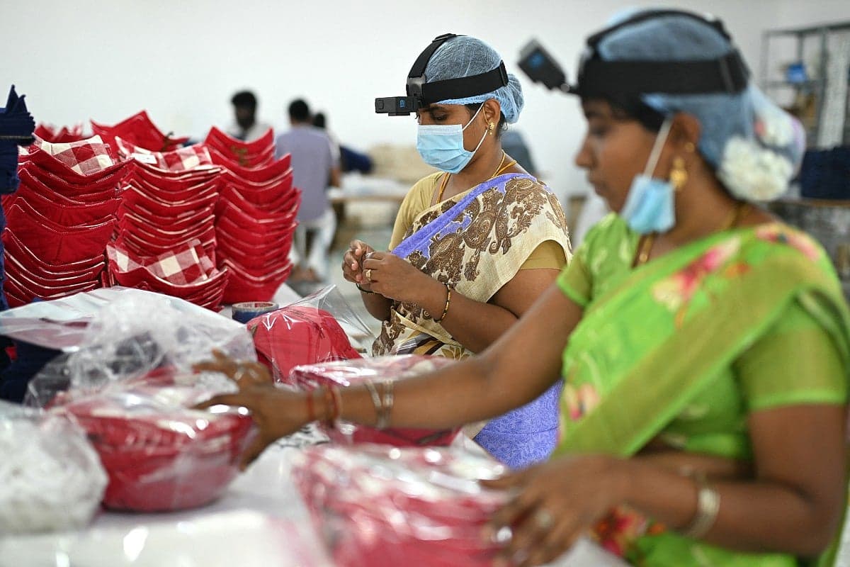 Indian workers training AI robots in various industries.