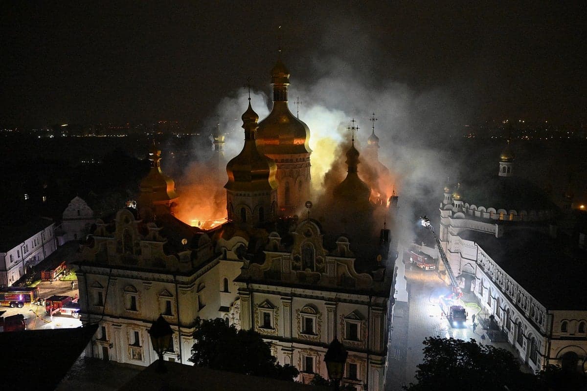 The Dormition Cathedral in Kyiv on fire, representing the threat to cultural heritage during military conflicts.