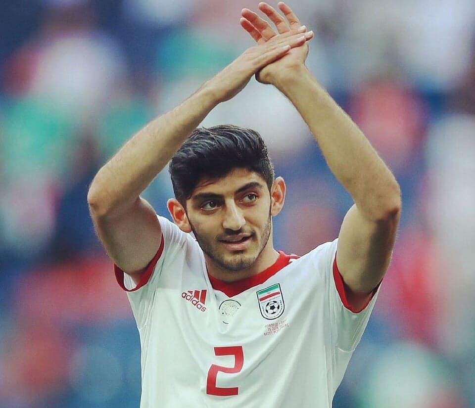 Mehdi Torabi celebrating with teammates after receiving his visa for the World Cup.