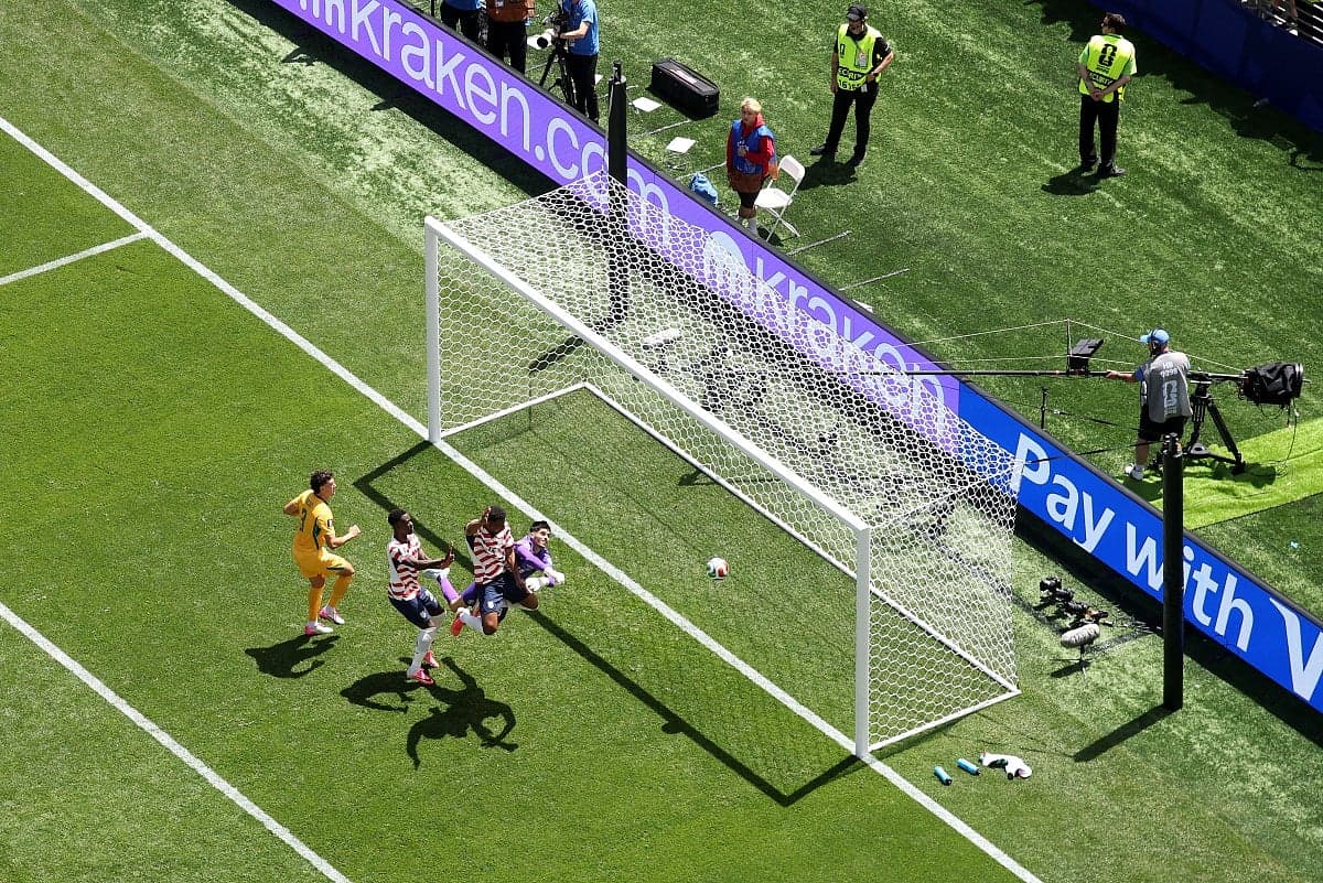 USA soccer team celebrating their victory over Australia in the World Cup