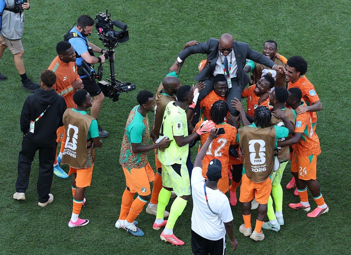 Côte d'Ivoire players celebrating their historic World Cup advancement