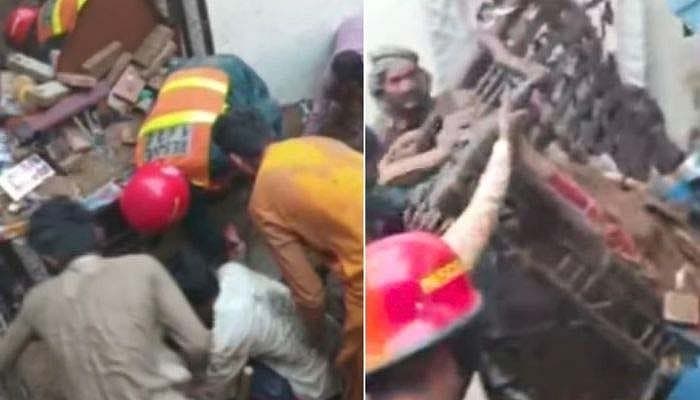 Emergency responders at the site of the Lahore tutoring centre roof collapse.