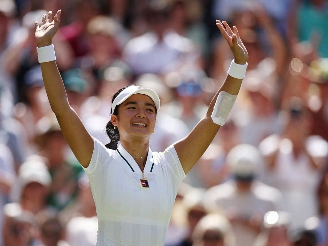 Alexandra Eala celebrating her victory over Iga Swiatek at Wimbledon.
