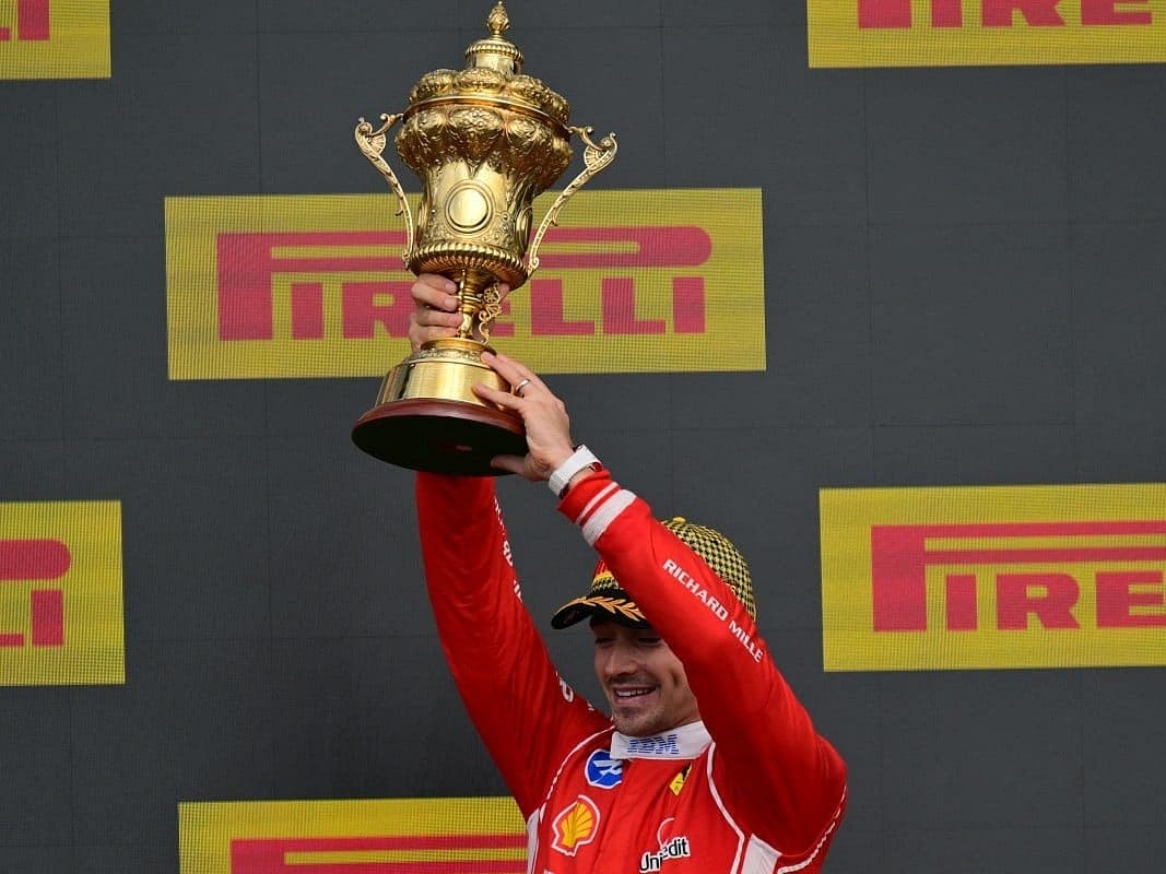 Charles Leclerc celebrating his victory at the British Grand Prix under safety car conditions.
