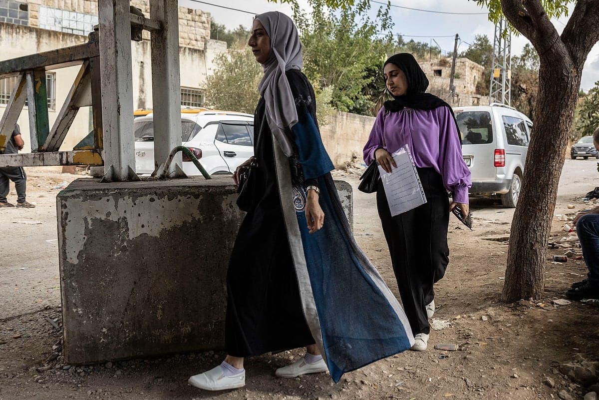 A somber image depicting the challenges of healthcare access at checkpoints in the West Bank.