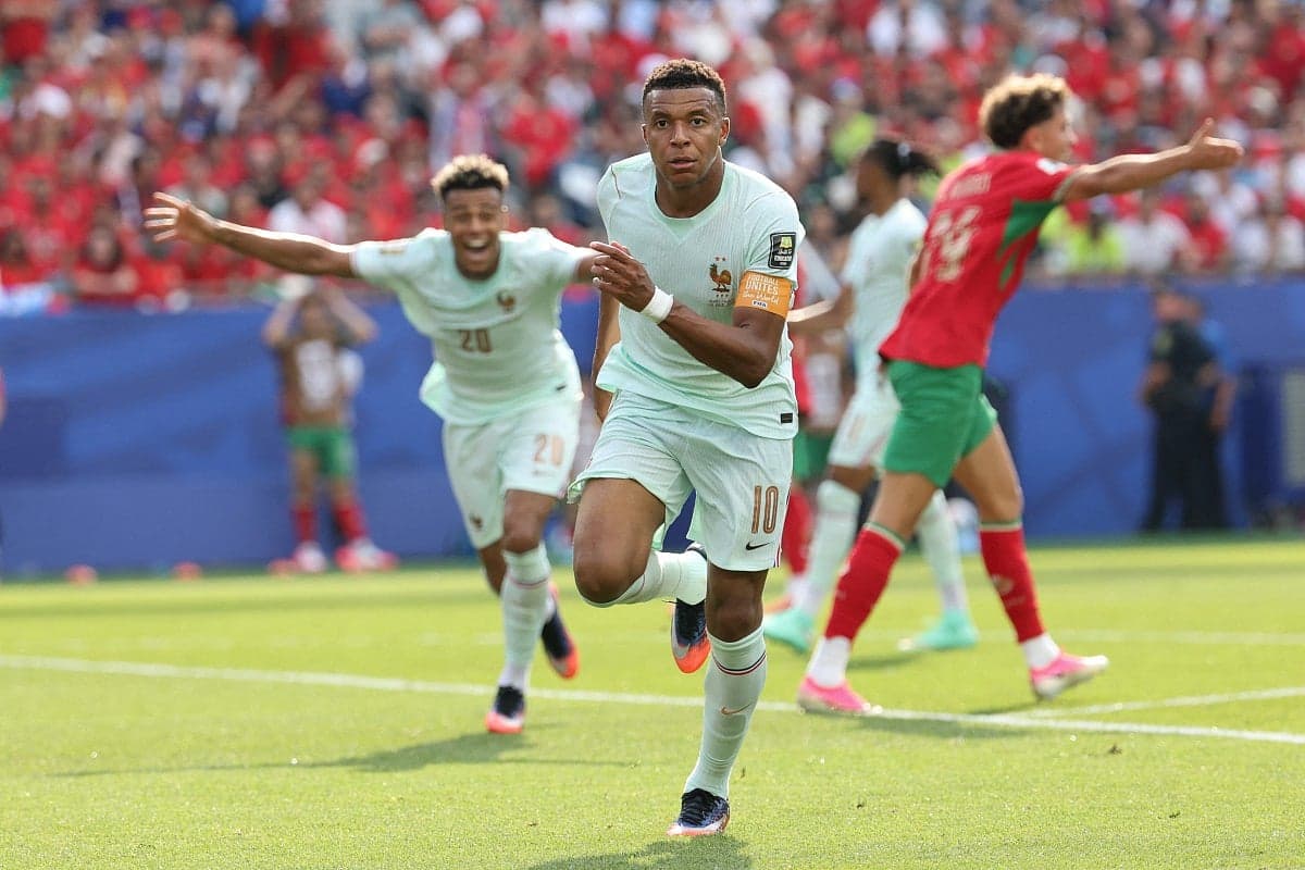 Kylian Mbappé celebrating after scoring against Morocco in the World Cup quarter-finals.
