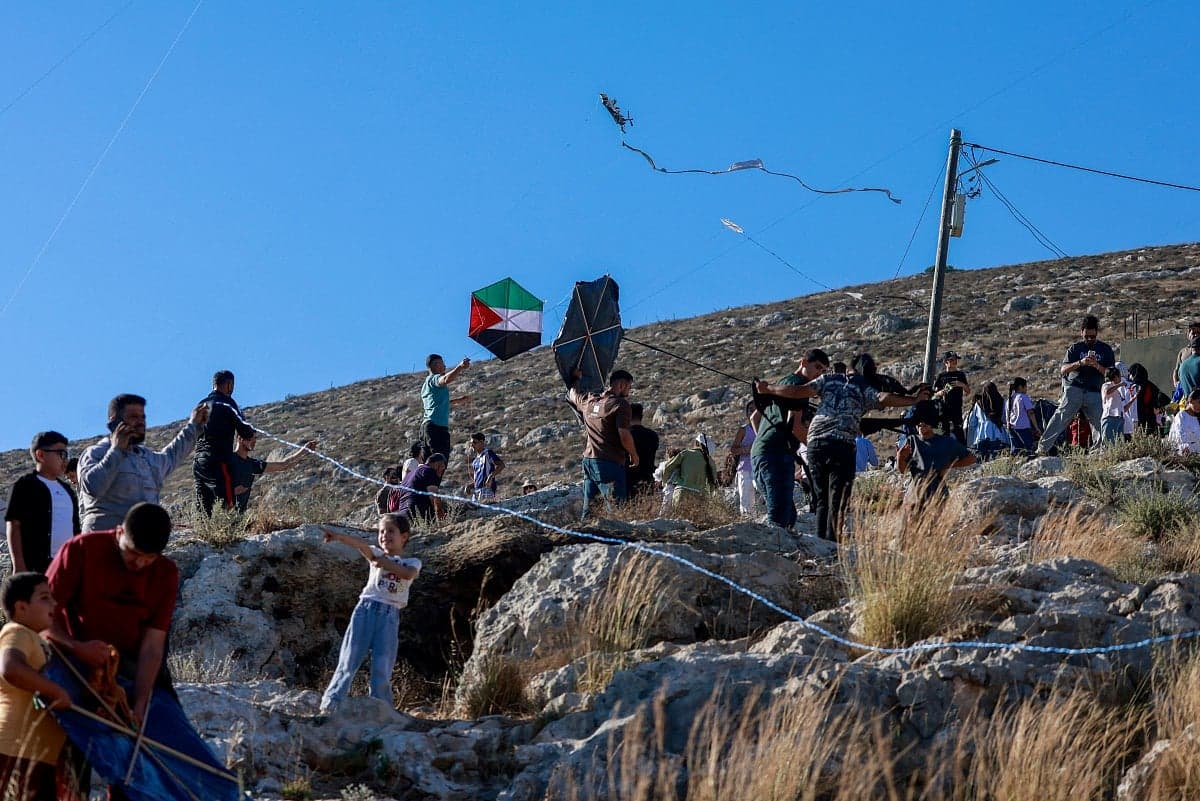 Children flying kites at the Palestinian kite festival in Burin village.