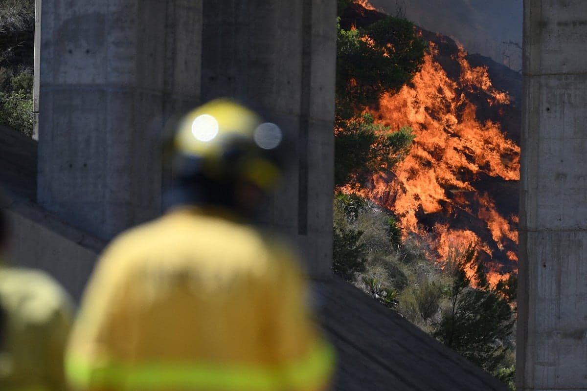 Aerial view of the wildfire in southern Spain with smoke and flames.