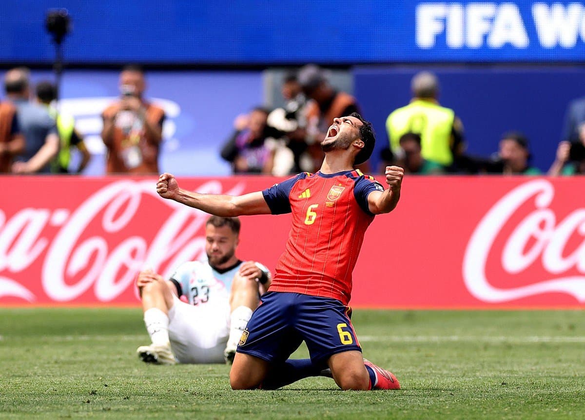Spain celebrates their victory over Belgium in the World Cup quarter-finals.