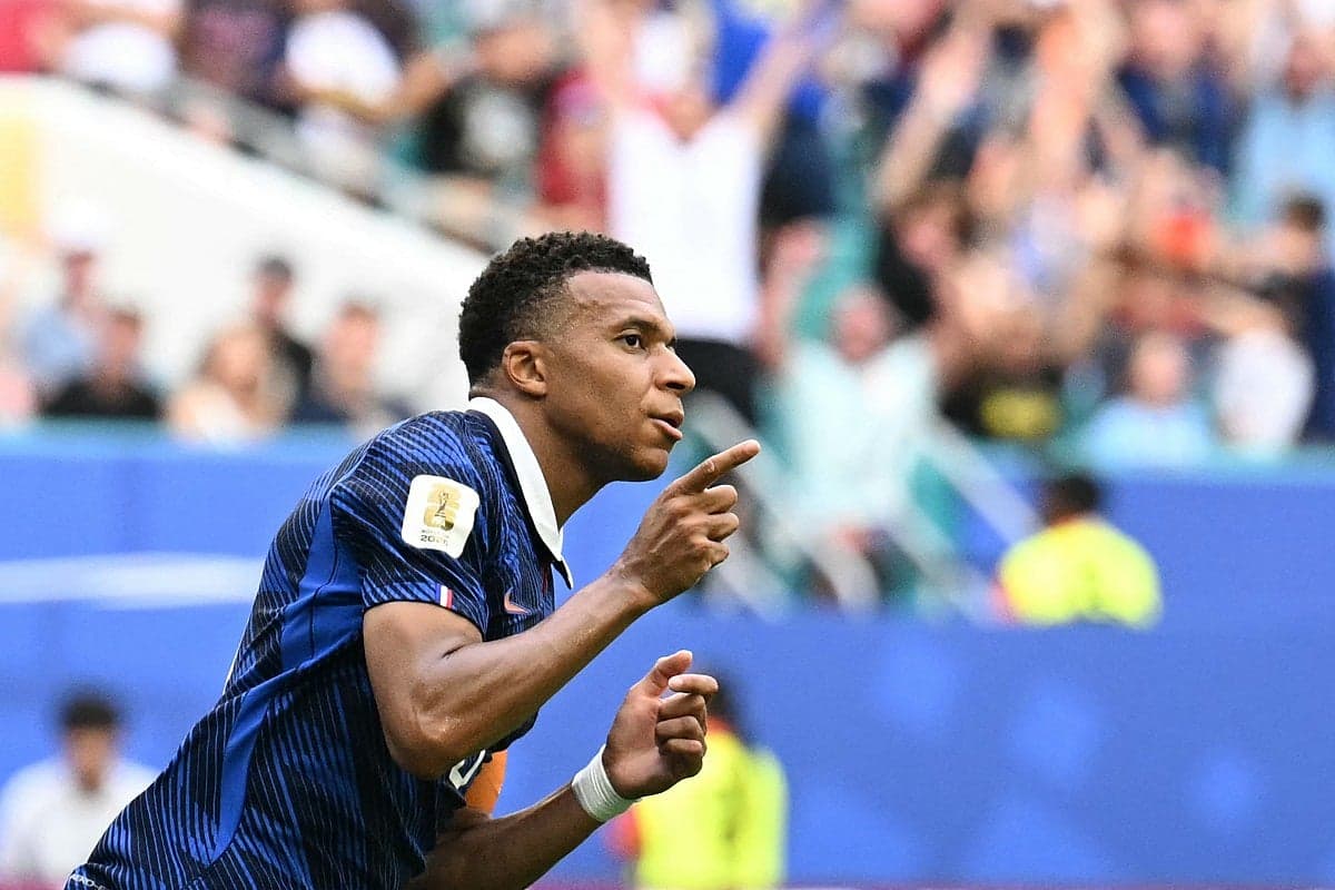 Kylian Mbappé celebrating his record-breaking goal in the FIFA World Cup.