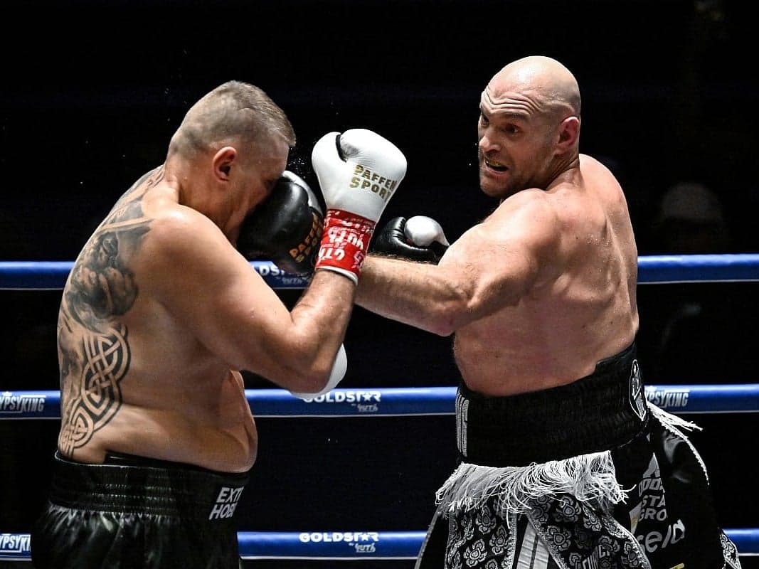 Tyson Fury celebrating his victory against Mariusz Wach in Thailand.
