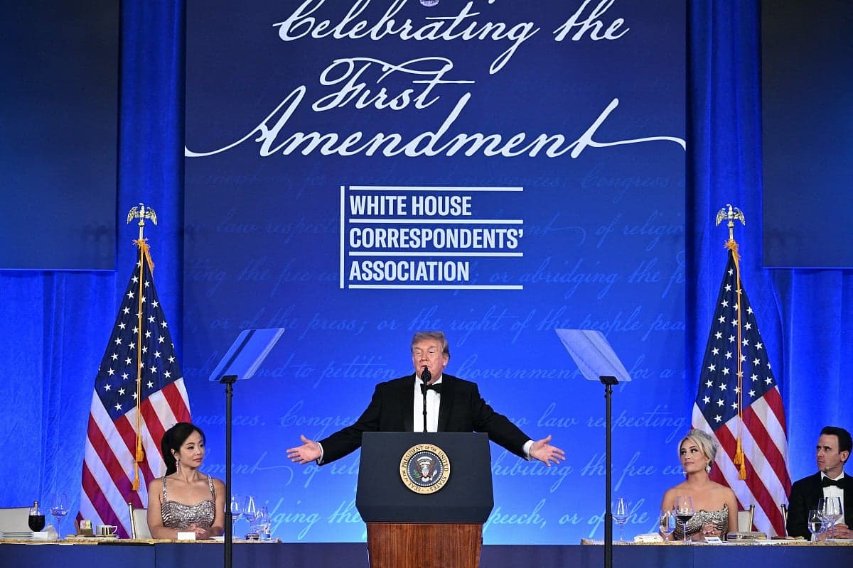 Trump speaking at the White House Correspondents' Dinner with media representatives in attendance.