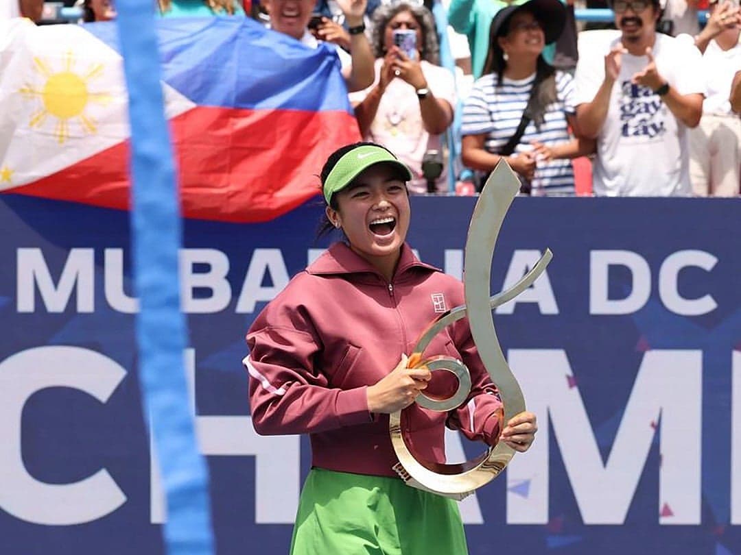 Alex Eala celebrating her first WTA title victory at the Mubadala DC Open.