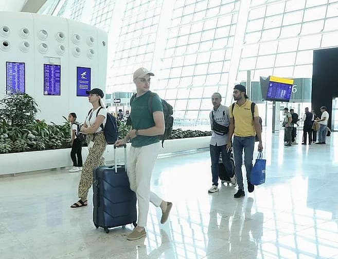 Flight cancellations and delays at UAE airports due to US-Iran tensions.