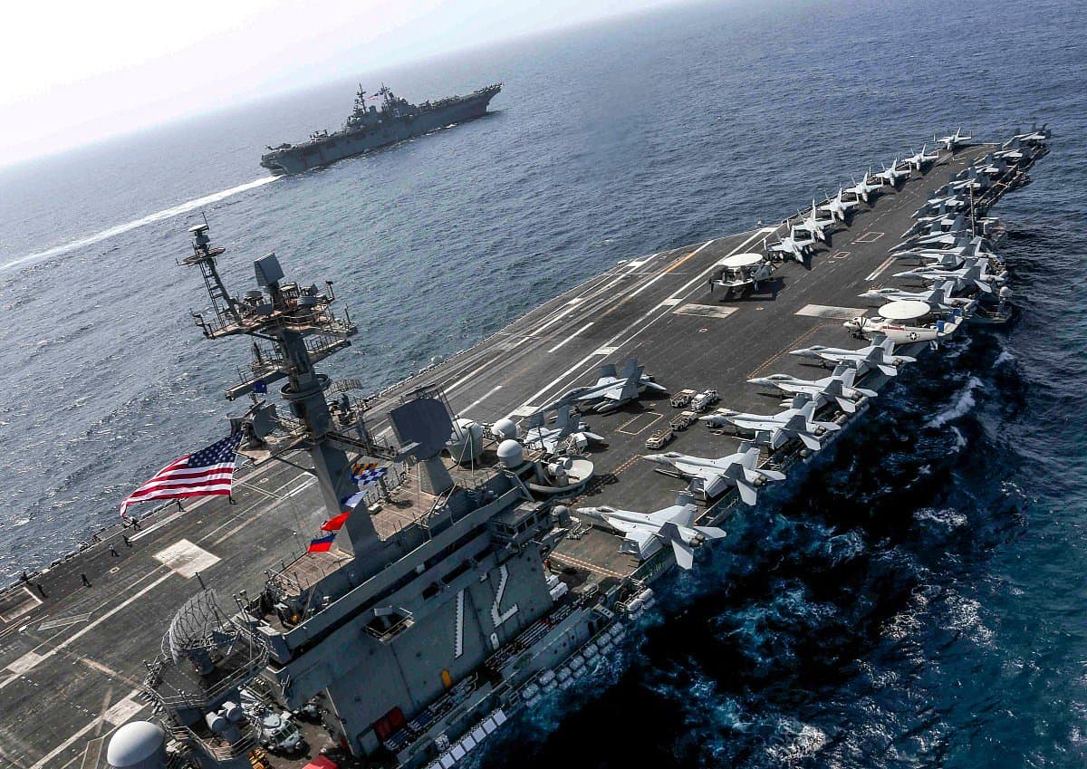 Adm. Brad Cooper visiting the USS Abraham Lincoln in the Middle East