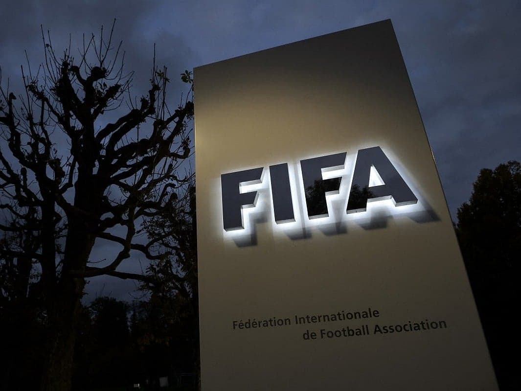 A graphic showing FIFA's logo and a headline about the dismissal of COO Kevin Lamour over criticism of President Infantino's plan.