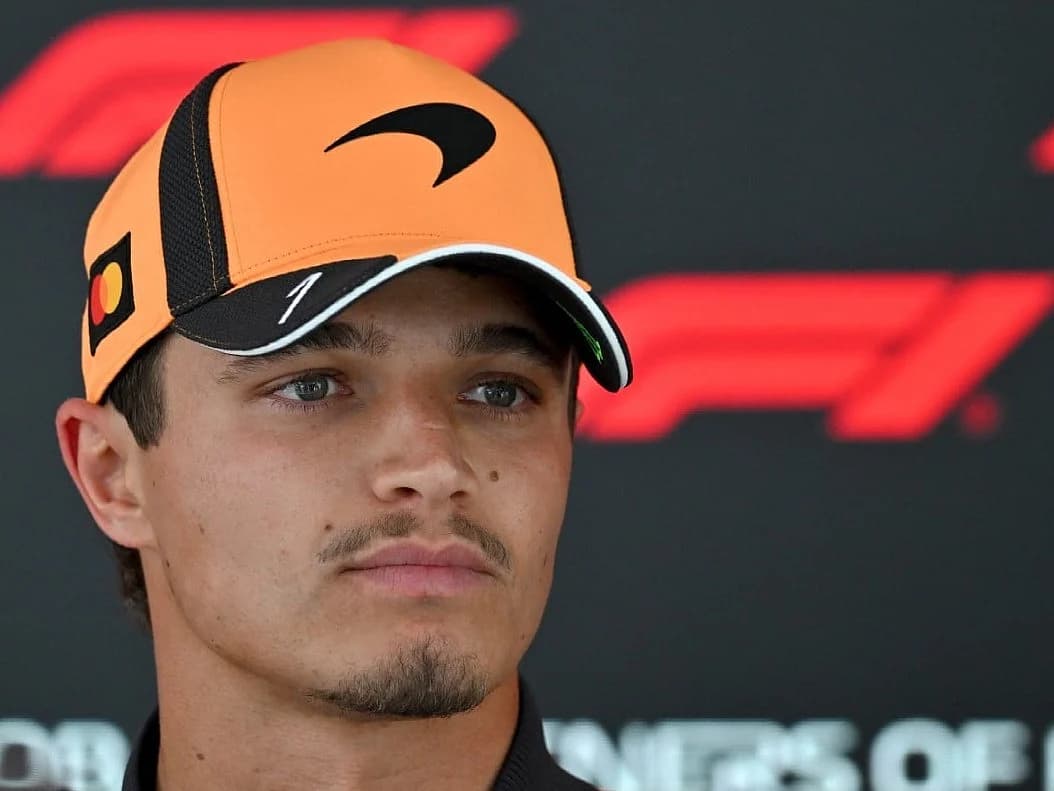 Lando Norris celebrating his contract extension with McLaren, showcasing his commitment to Formula 1 through 2030.