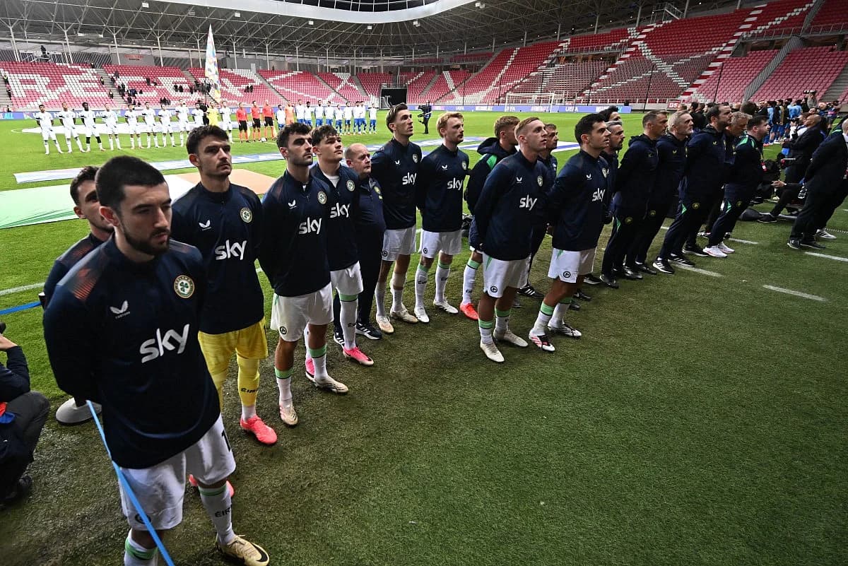 Irish football players wearing black armbands during the Israeli anthem, symbolizing political expression in sports.