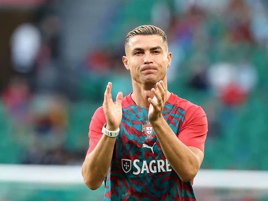 Cristiano Ronaldo in action for Portugal, with a backdrop of the national team colors and a question mark symbolizing uncertainty.