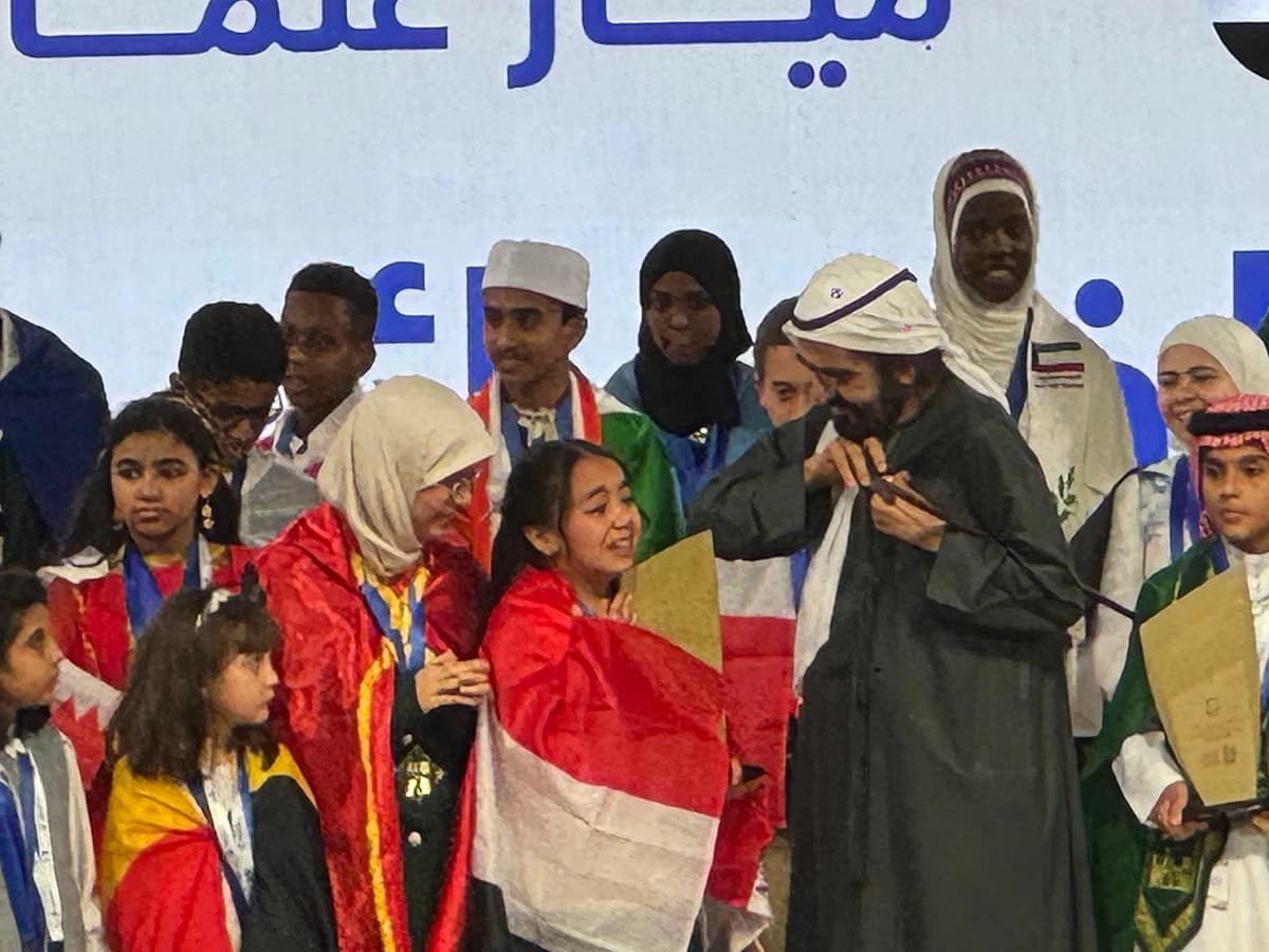 Graphic displaying 40.2 million Arab Reading Challenge participants text overlay on deep navy minimalist background.