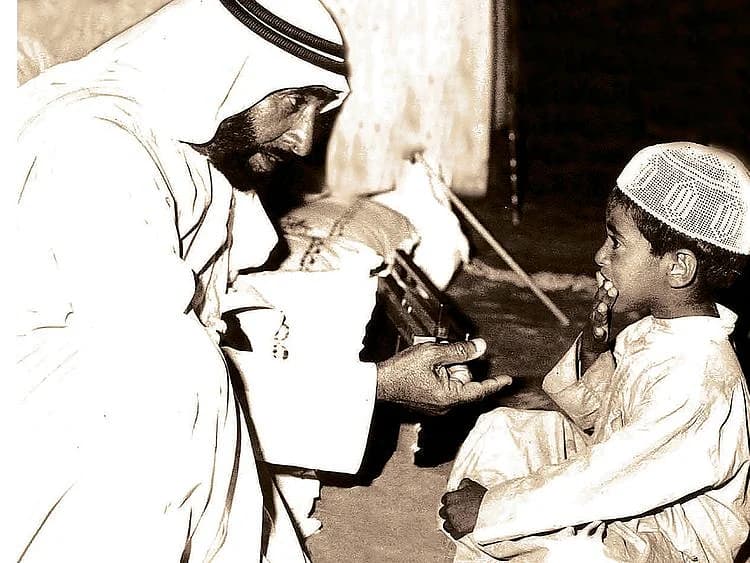 Minimalist editorial graphic displaying Zayed the Founder Day typography over gold and slate background