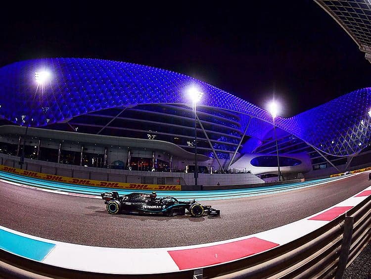 F1 race car on track with a backdrop of geopolitical maps