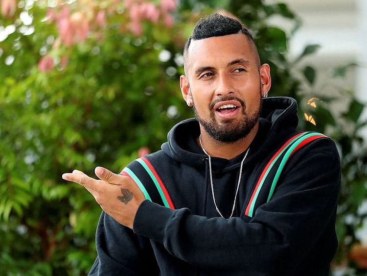 Nick Kyrgios during a tennis match, with a headline about his provisional suspension for a positive cocaine test.