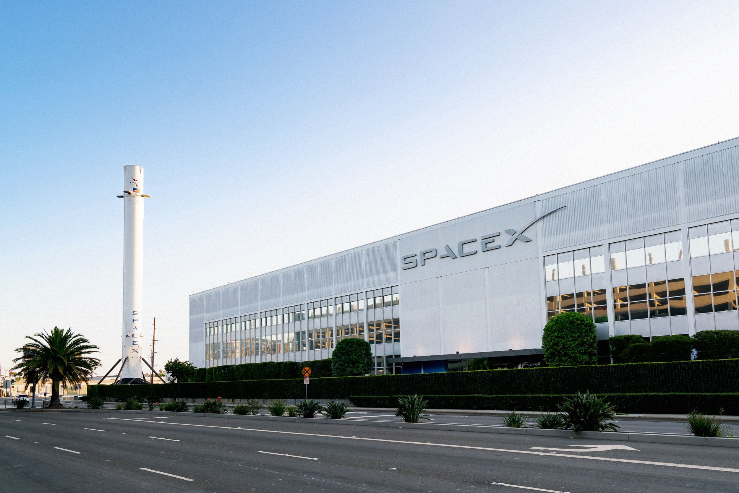 Anthropic and SpaceX logos with a backdrop of AI technology graphics
