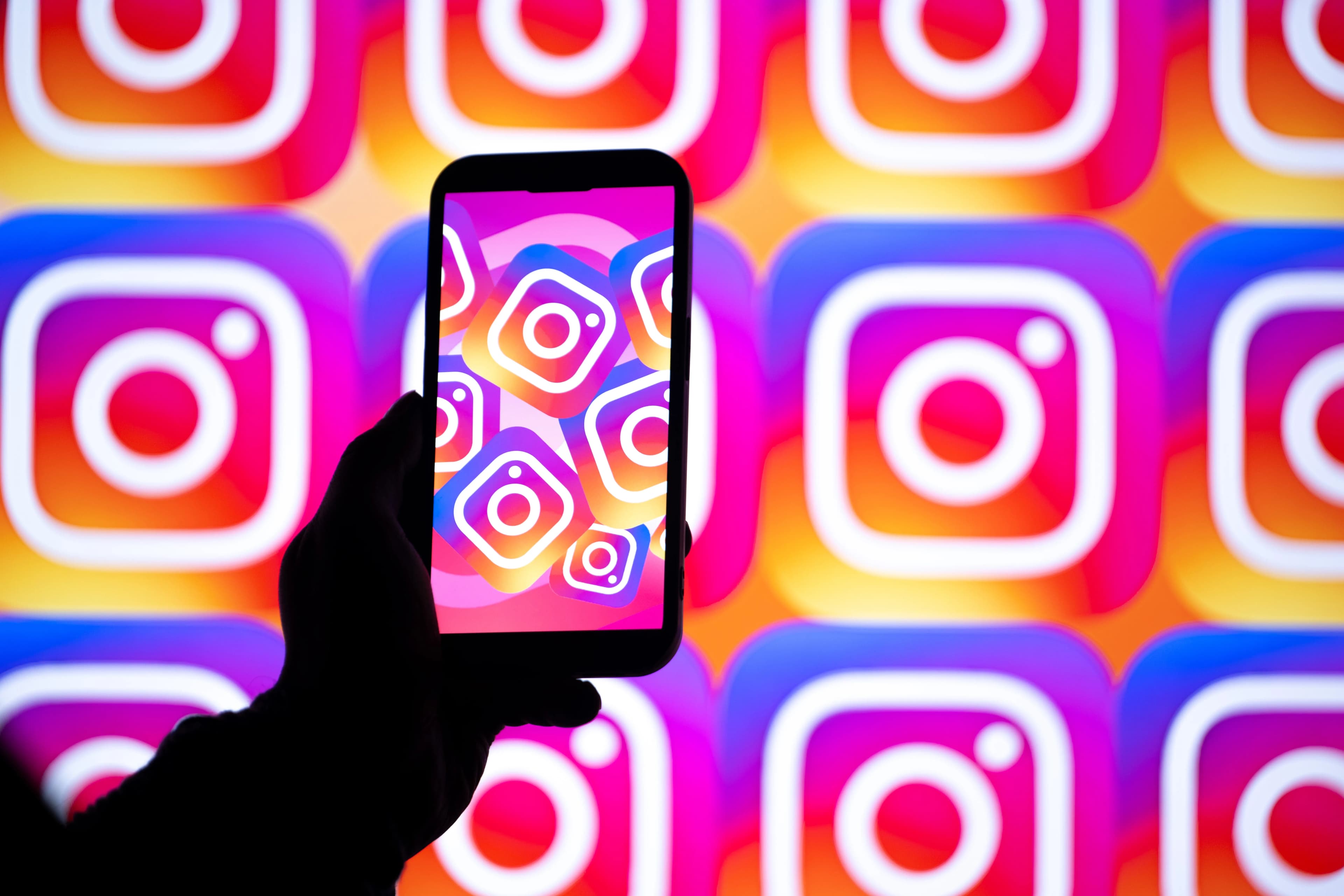 Minimalist graphic showing Instagram video interface transitioning from a vertical smartphone to a widescreen television display.