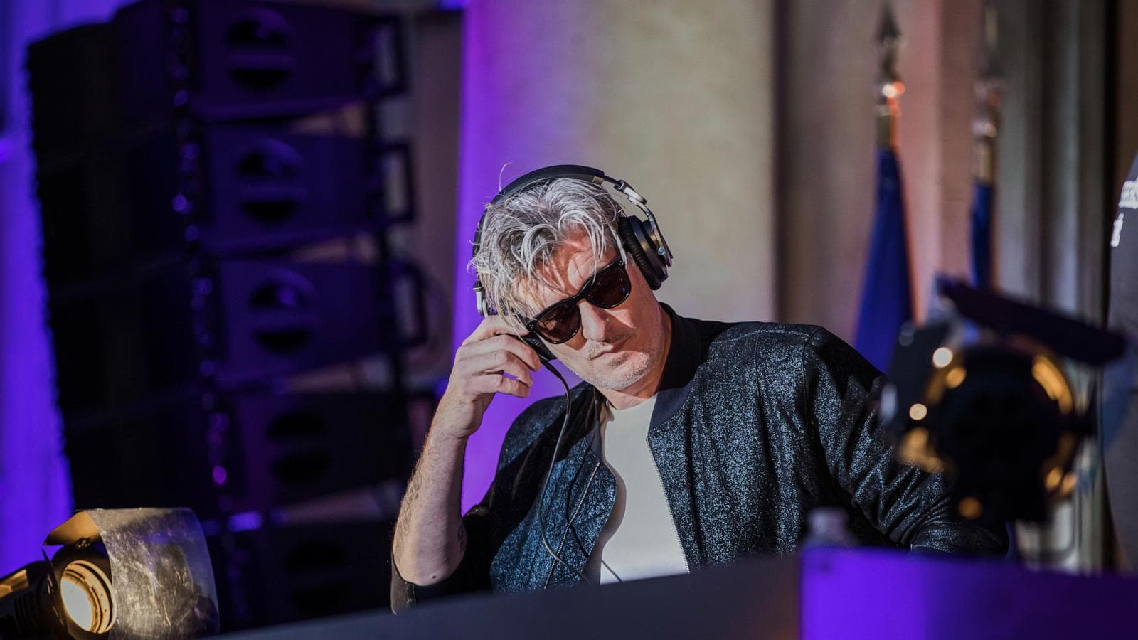 Kavinsky performing live, capturing the essence of his electronic music legacy.