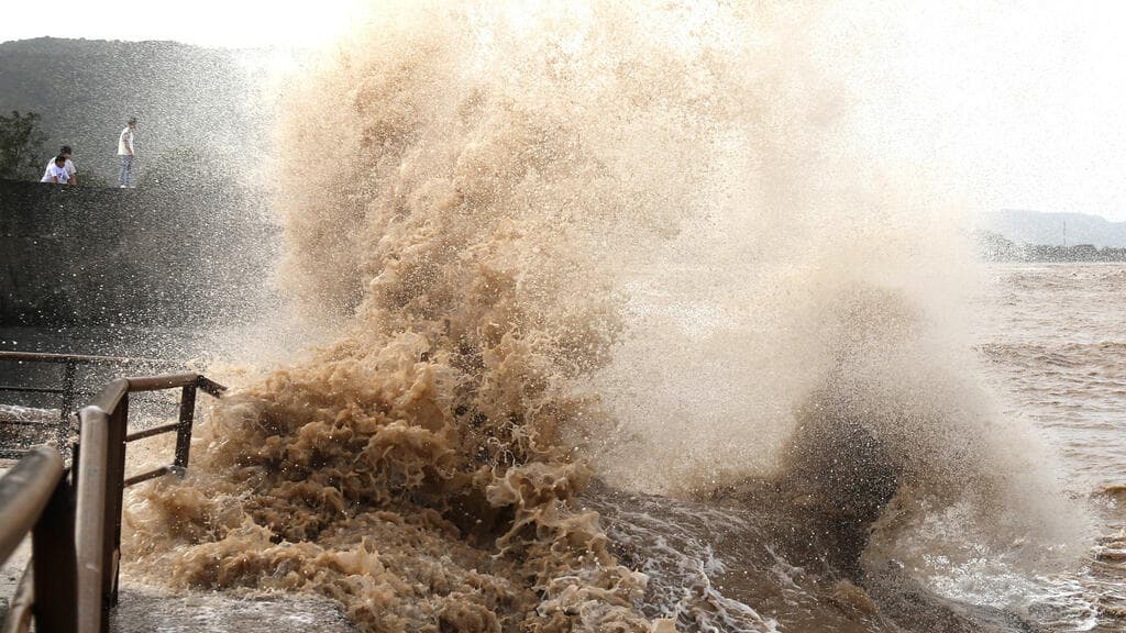 Evacuation efforts in eastern China as Typhoon Bavi approaches.