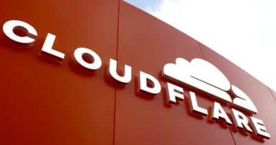 Cloudflare logo with a backdrop of AI technology graphics