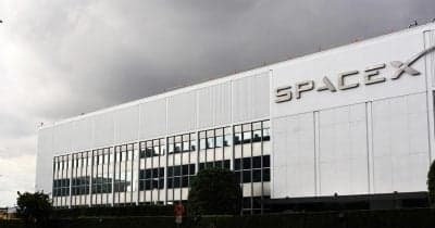 SpaceX logo with a backdrop of financial graphs and Bitcoin symbols.