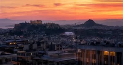 Greece's Finance Ministry building with cryptocurrency symbols