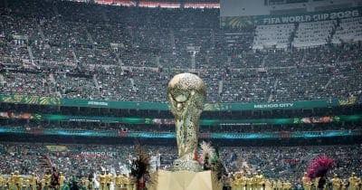 Kraken logo alongside FIFA World Cup 2026 branding with scam alert icons