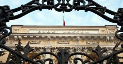 Bank of Russia building with financial graphs overlay