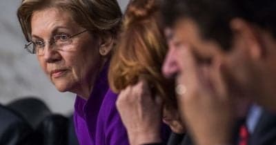 Senator Elizabeth Warren speaking at a press conference about financial regulation.