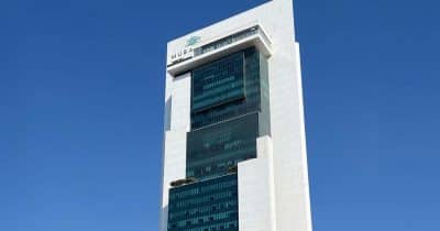 Mubadala Investment Company logo with a financial backdrop
