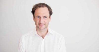 Richard Heathcote discussing Tether's future amidst regulatory challenges.
