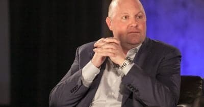 Marc Andreessen speaking at a conference on technology and economics.