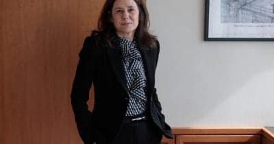 Lorie Logan speaking at a Federal Reserve event on inflation and interest rates.