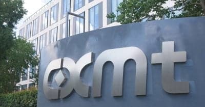 CXMT logo with a backdrop of the Shanghai Stock Exchange