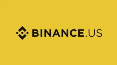 Binance.US logo with a backdrop of cryptocurrency market graphics