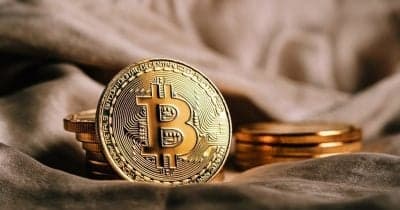 Gumi and SBI Financial Services logo with cryptocurrency graphics