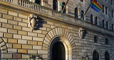 US Treasury building with currency exchange rates displayed