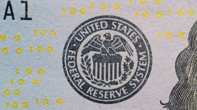 A graphic illustrating the Federal Reserve's rate hike and its impact on the Dow Jones Industrial Average.