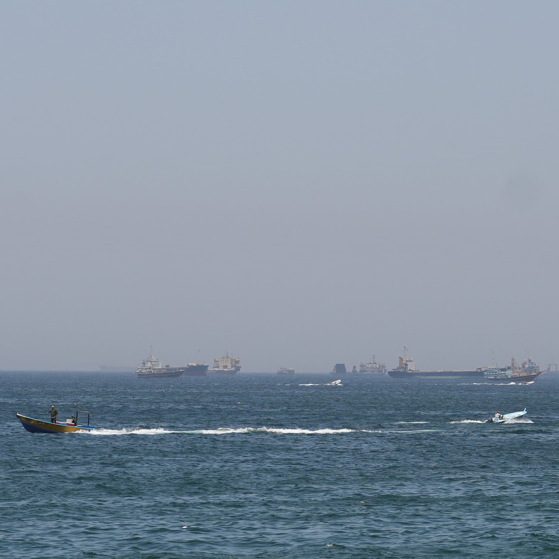 Shipping vessels stranded in the Strait of Hormuz due to conflict