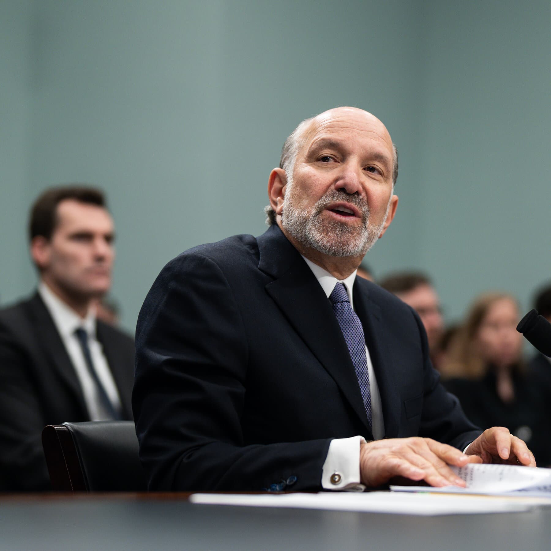 Howard Lutnick testifying before Congress regarding Epstein connections.